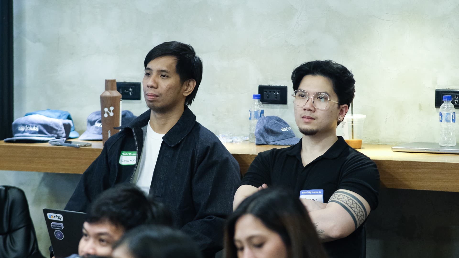 Two Clay Club Manila attendees watching intently during the 6th meetup at Acceler8 Rockwell Makati