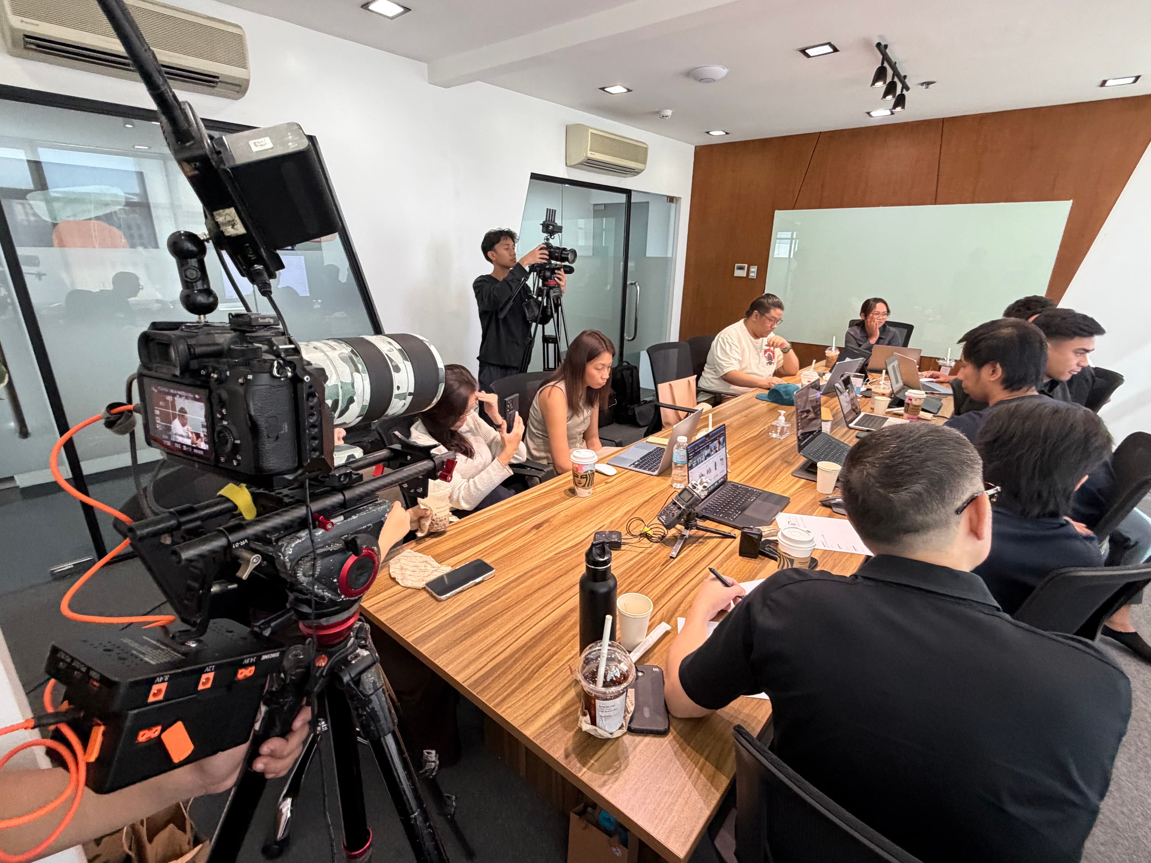 Professional camera crew filming the Clay Cup Manila nomination event at LOFT Spaces Eastwood Quezon City with competitors working at a long table