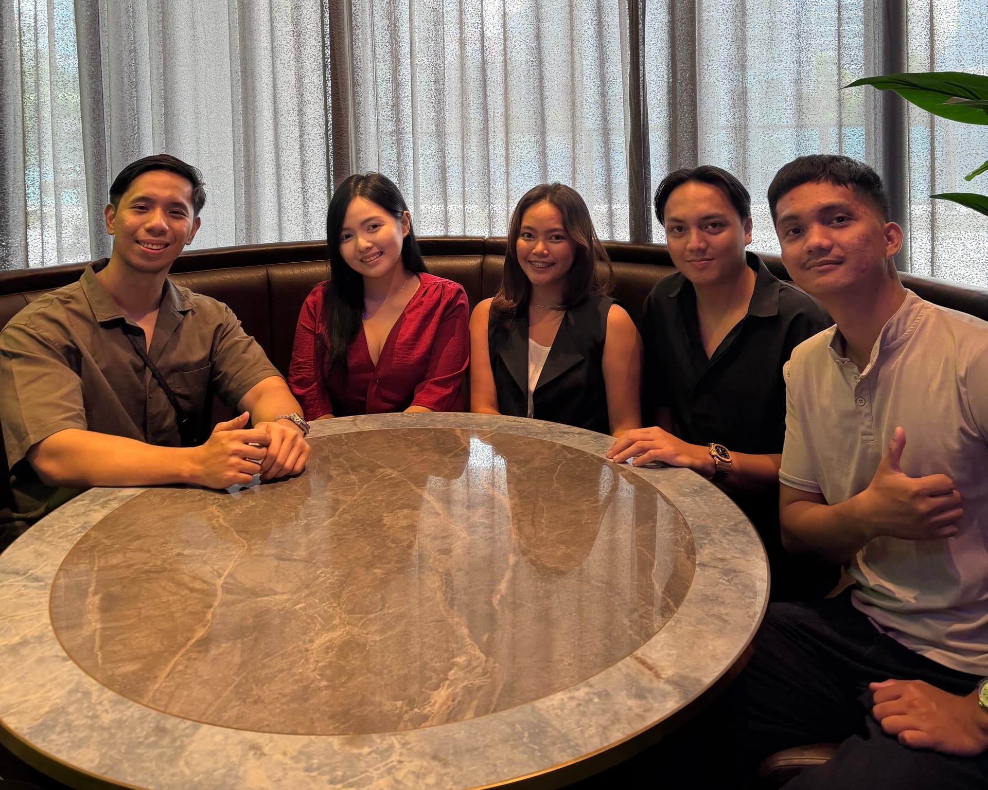 The Lead Assassin team at a team lunch in Manila